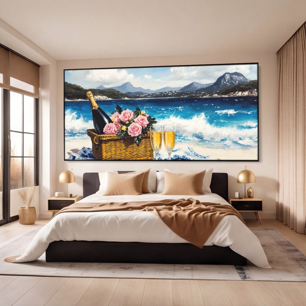Tablou canvas cu pictura cu picnic pe plaja cu sampanie, in rama de aluminiu negru, pe perete intr-un dormitor